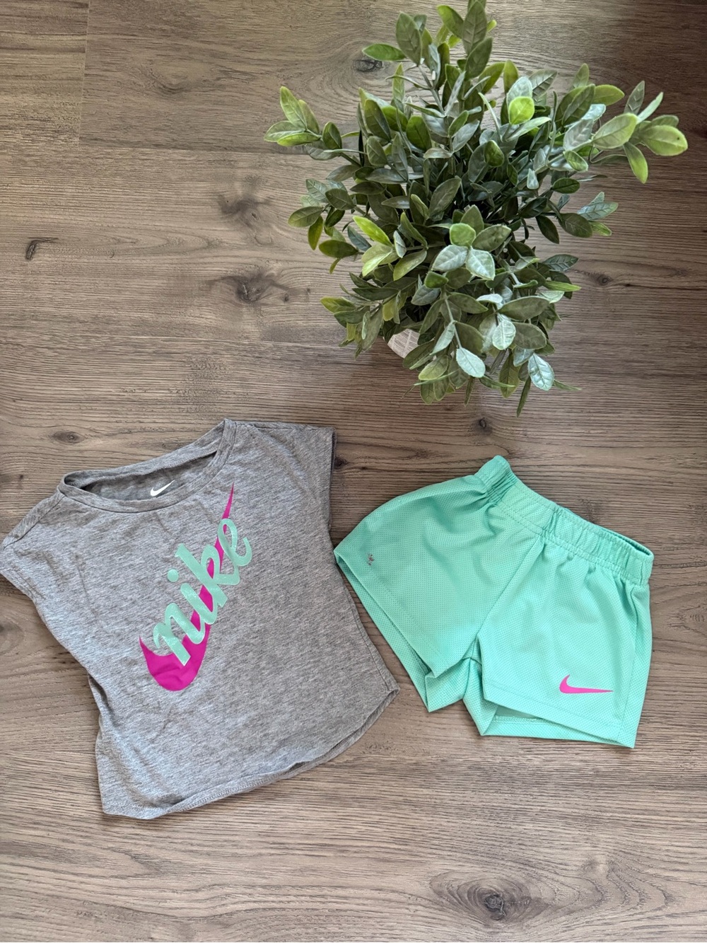 Nike Mint Green Athletic Shorts with Pink Swoosh